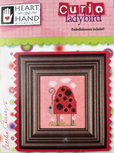 Cuore mano curio coccinella - in,